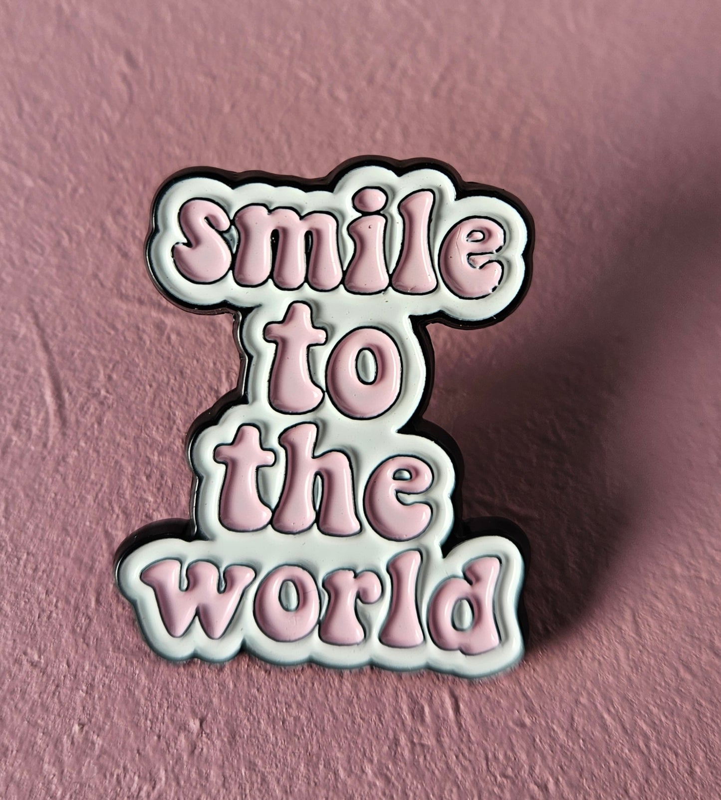 Pin 'smile to the world'