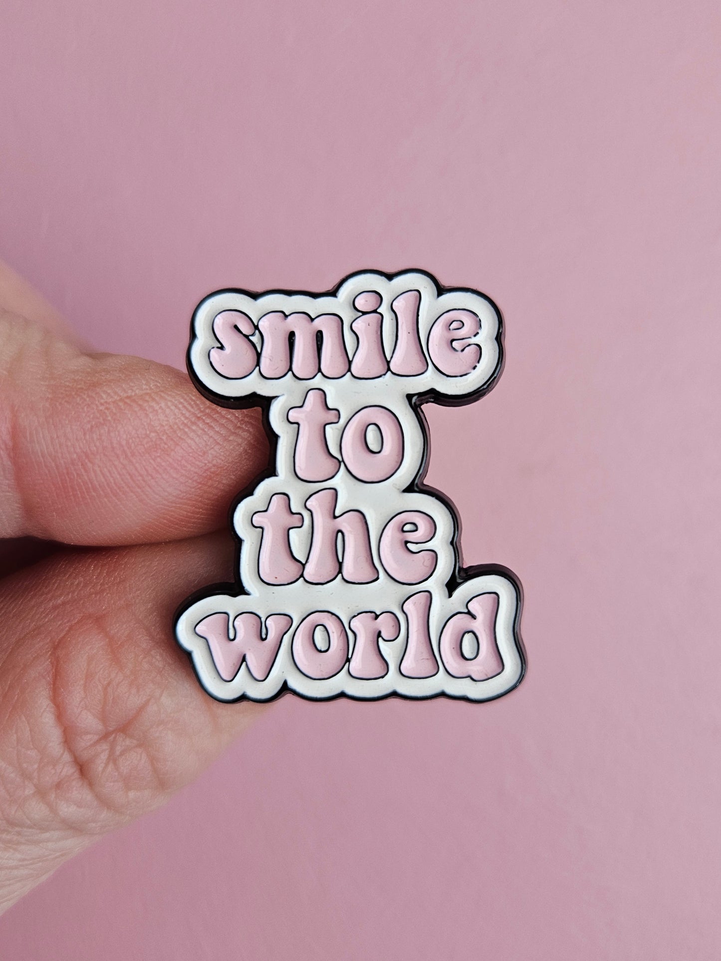 Pin 'smile to the world'